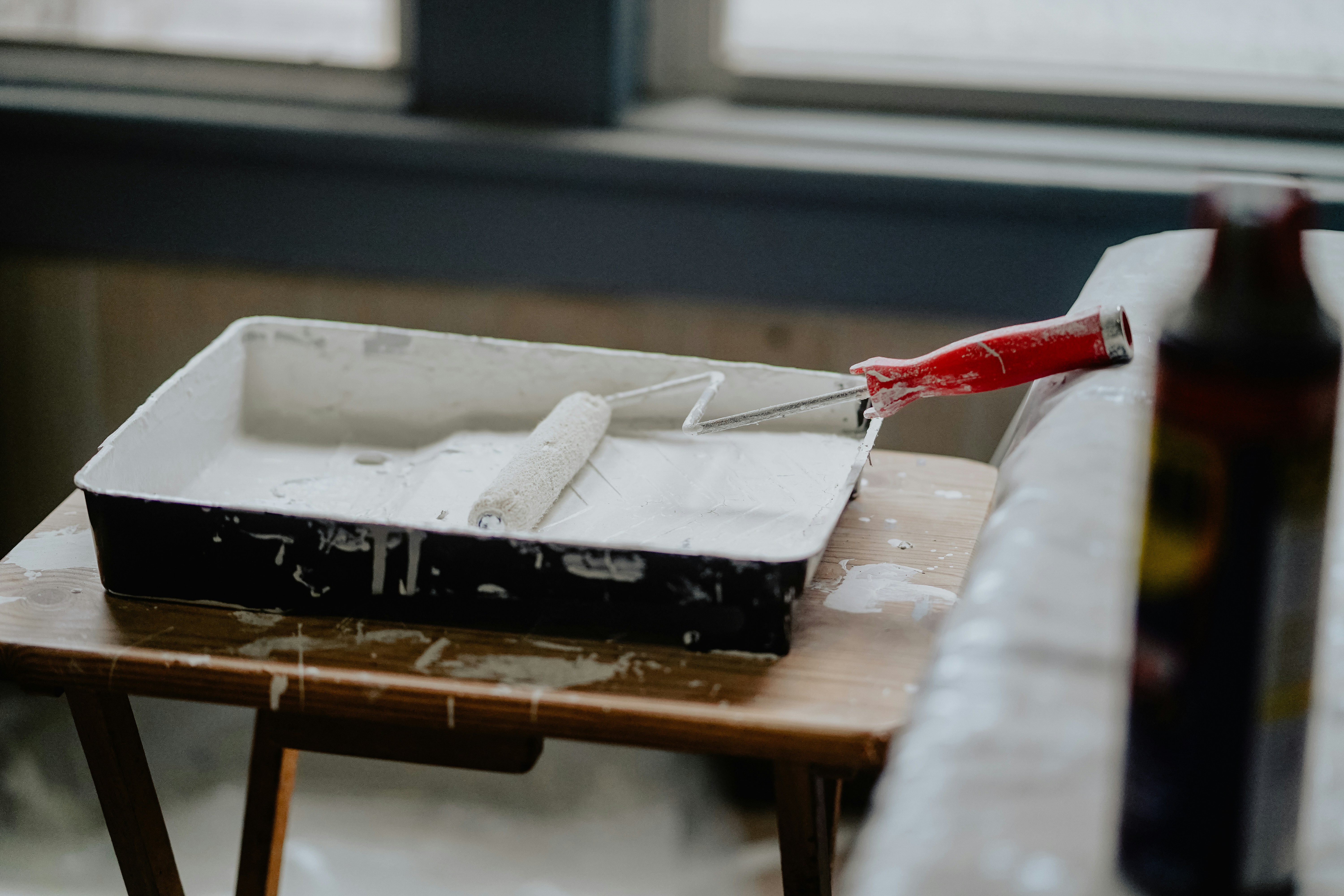 Touch-up painting on a wall in a San Antonio home